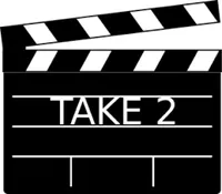 A black and white clapperboard with the text TAKE 2.