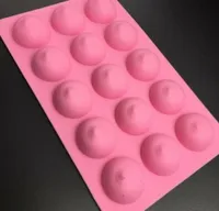 A pink silicone mold with 15 cavities in the shape of a woman's breast.