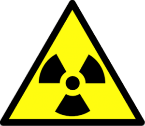 A black and yellow triangular sign with a radiation symbol.