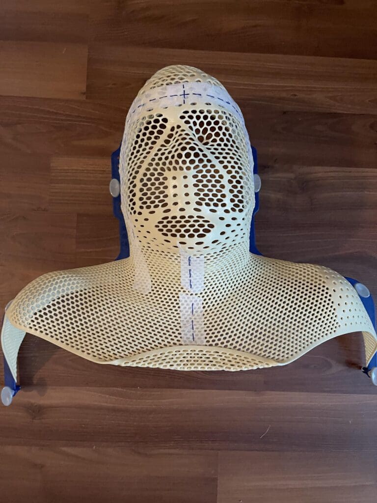 Yellow plastic head and neck support brace.